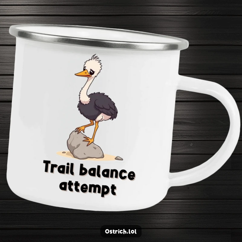 Funny camping mug showing a wobbly ostrich character attempting to balance a small rock, ideal for outdoor humor.