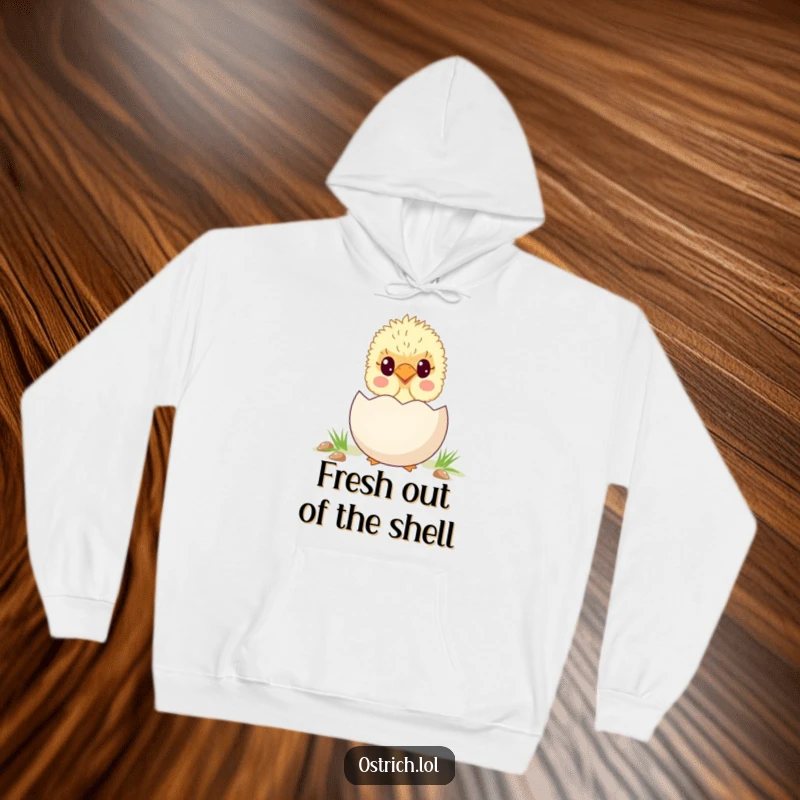 Funny and very cute ostrich chick peeking out from behind a giant egg, printed on a comfortable and humorous hoodie.