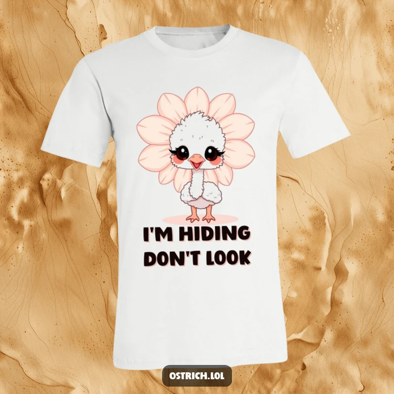 Funny baby ostrich peeking playfully from behind a large flower on a soft t-shirt, showcasing a cute and curious character.