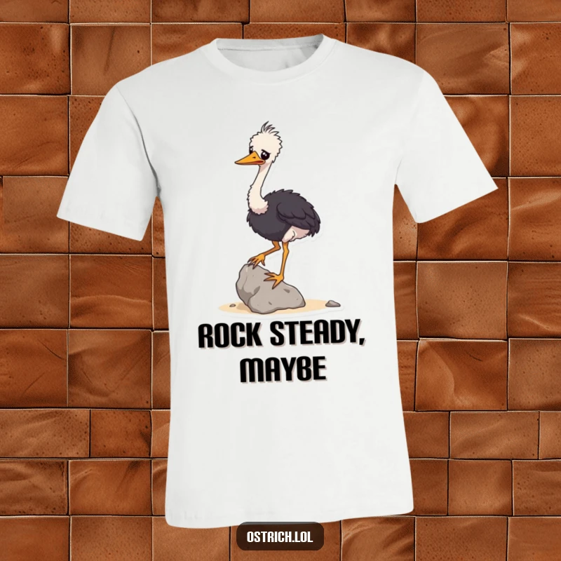 Funny t-shirt featuring a wobbly ostrich character trying its best to balance a small rock, a humorous and relatable scene.