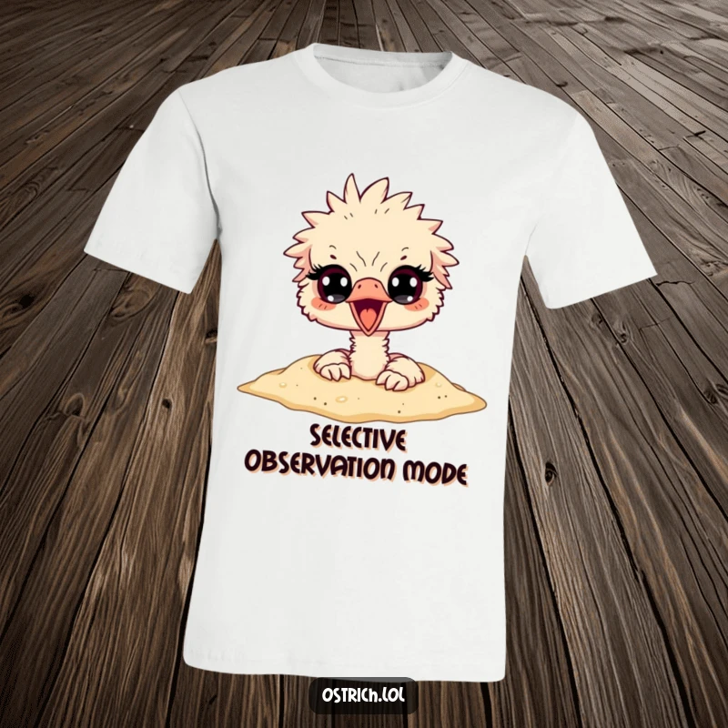 Funny ostrich character buried headfirst in sand, with only its surprised eyes visible, printed on a funny t-shirt.